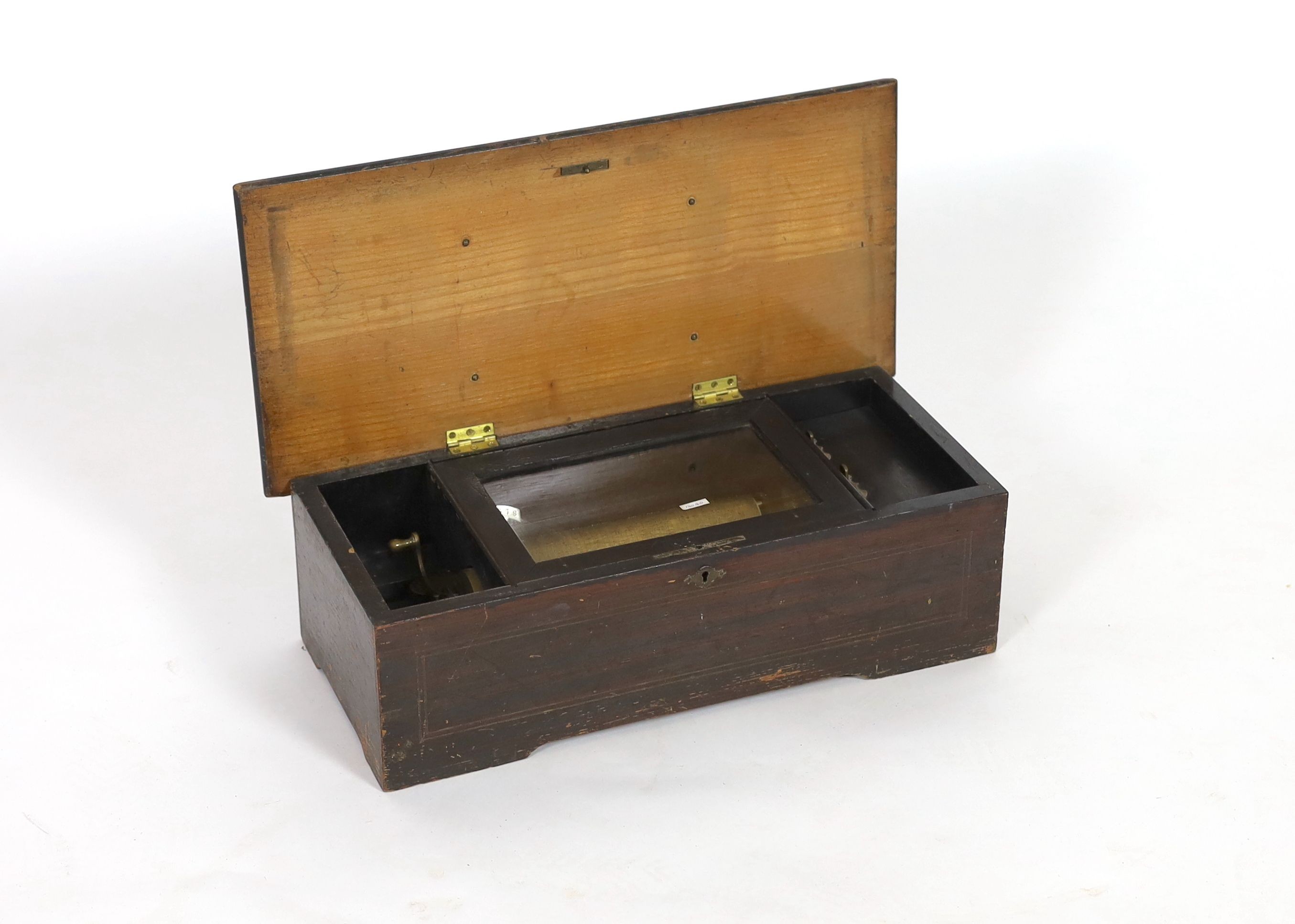 A late 19th century Swiss music box, with 18cm cylinder, in inlaid walnut and simulated walnut case, width 49cm